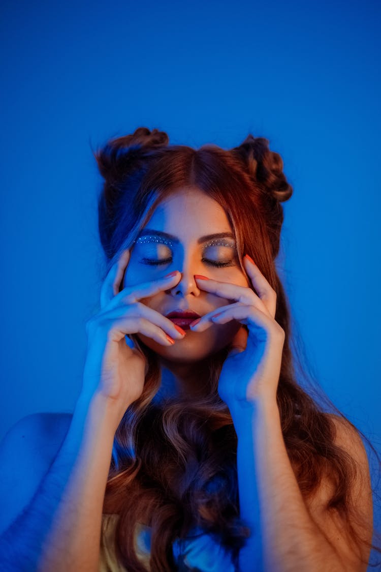 Woman Posing On Blue Background