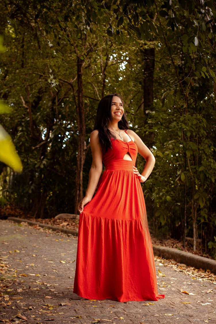 A Woman In Orange Dress Smiling