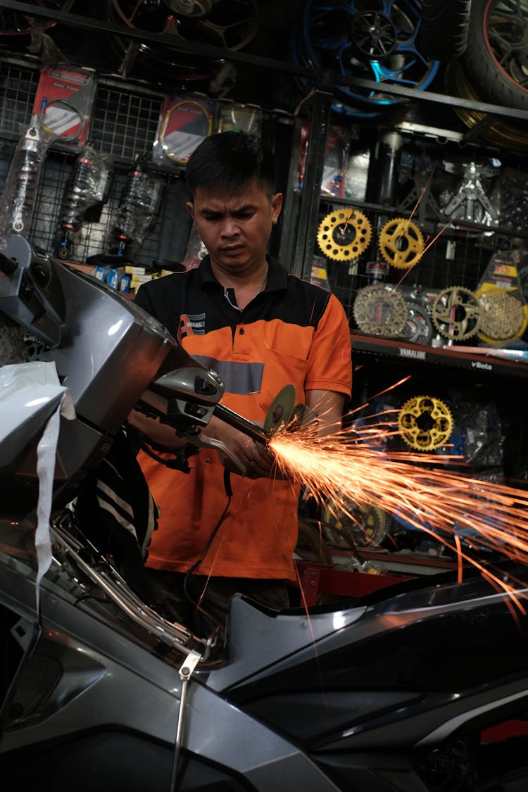 Man Working With Grinder