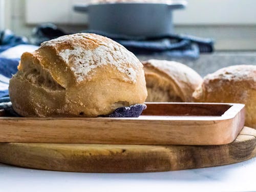 Freshly Baked Bread on a Wooden Tray