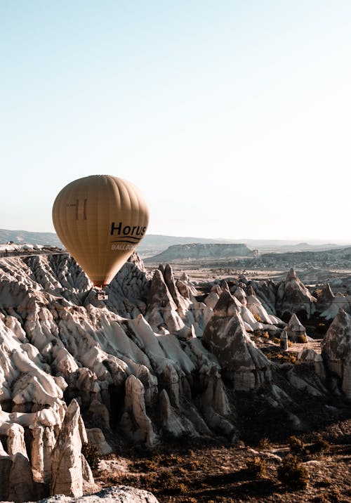 A Balloon Flying Over Mountains 