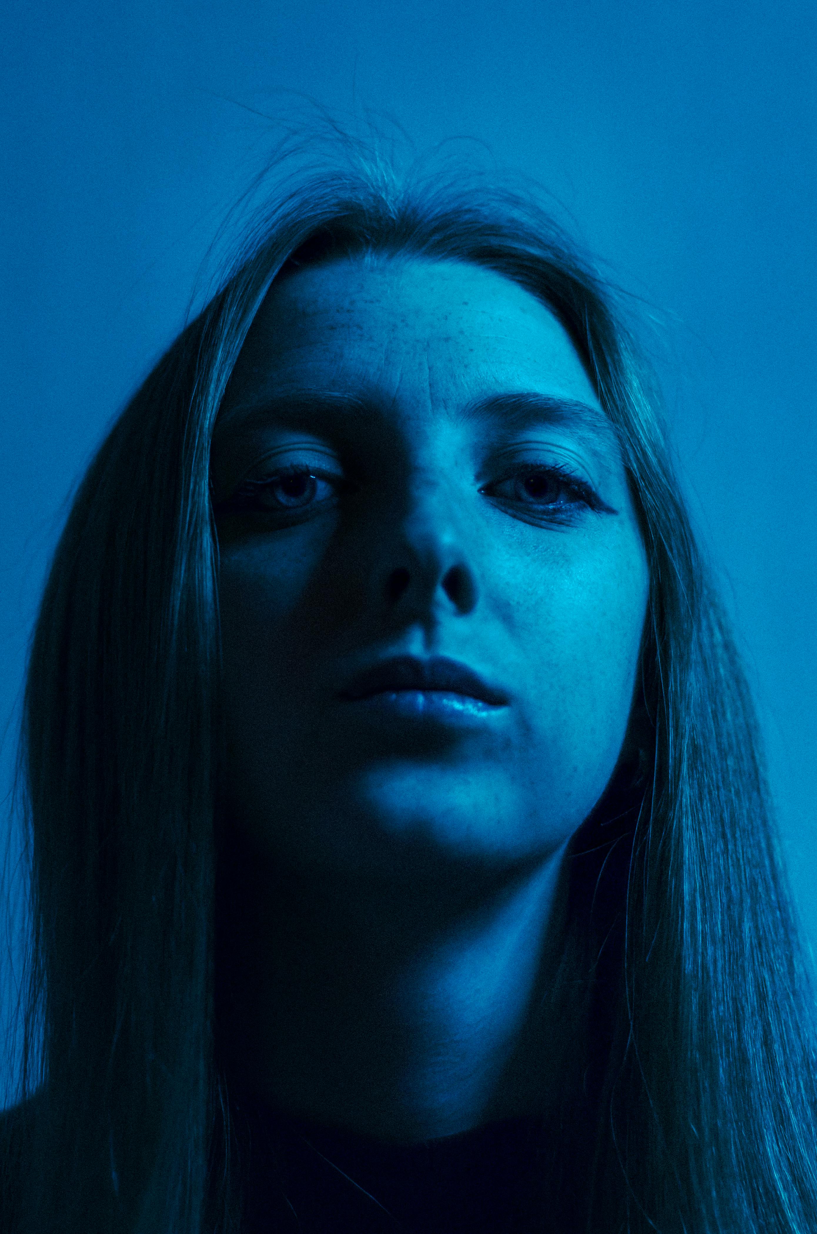 Portrait of a Woman in Blue Lighting · Free Stock Photo