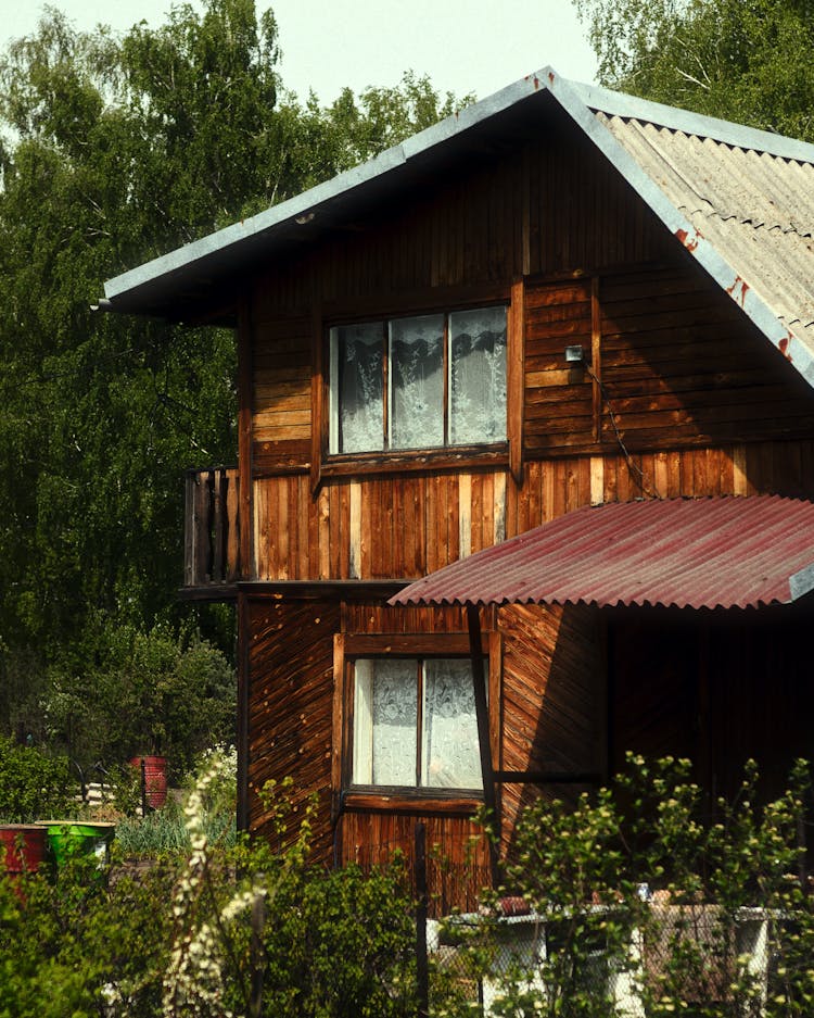 Photo Of A Wooden Cabin Placed In A Garden