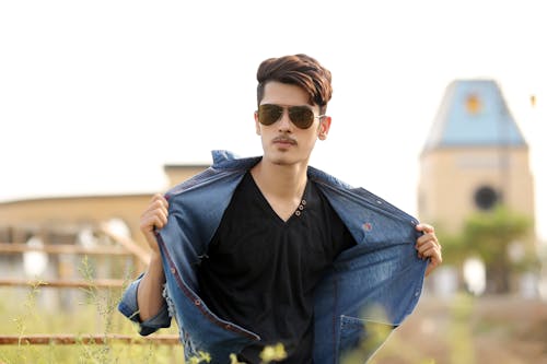 Young Man in Sunglasses Posing Outdoors 