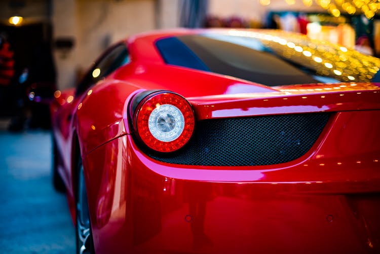 Red Sports Car In Close Up Photography