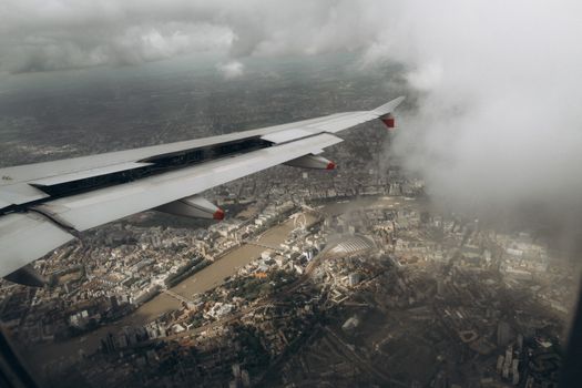 Stunning aerial view of London, capturing iconic landmarks from an airplane window.