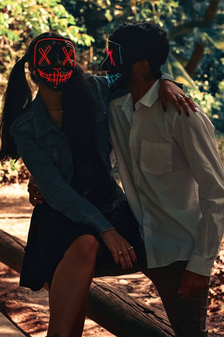 Couple Wearing Glowing Masks