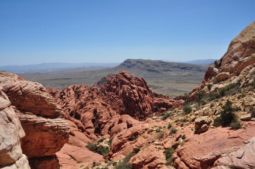 Free Breathtaking view of Red Rock Canyon's rugged red formations under a clear blue sky. Stock Photo