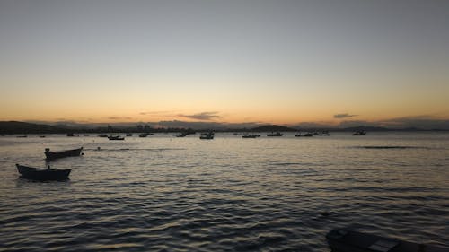 Boats on the Ocean during Sunset