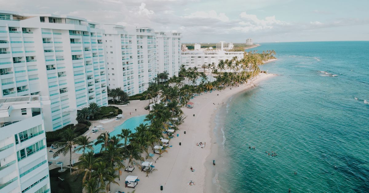 A stunning aerial view of luxury beachfront resorts in Juan Dolio, Dominican Republic.
