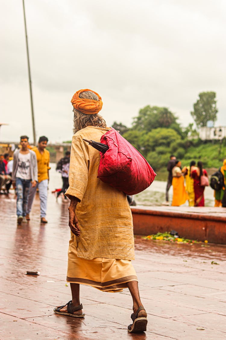 Monk Wandering In Rain