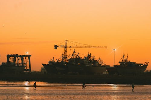 Ships During Sunset at the Shipping Port