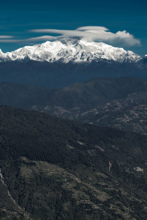 Free A breathtaking landscape showcasing the majestic snow-covered peaks of the Himalayas under a clear blue sky. Stock Photo