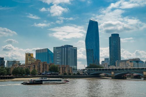 Free Stunning view of London's skyline featuring modern skyscrapers along the River Thames. Stock Photo