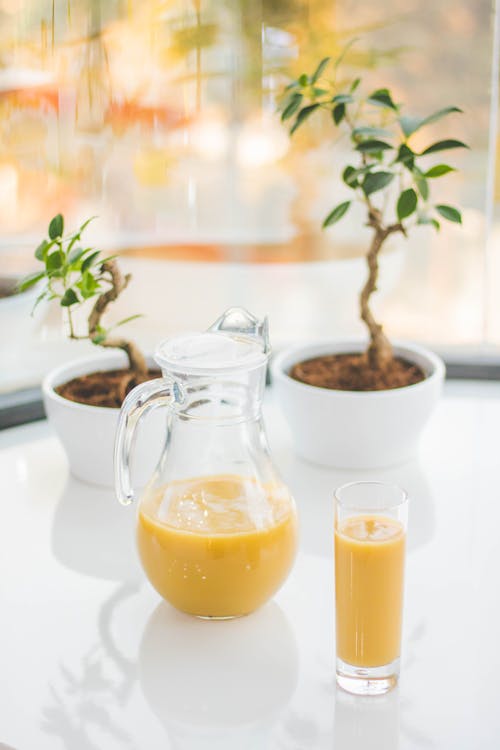 Clear Glass Pitcher With Yellow Fruit Juice