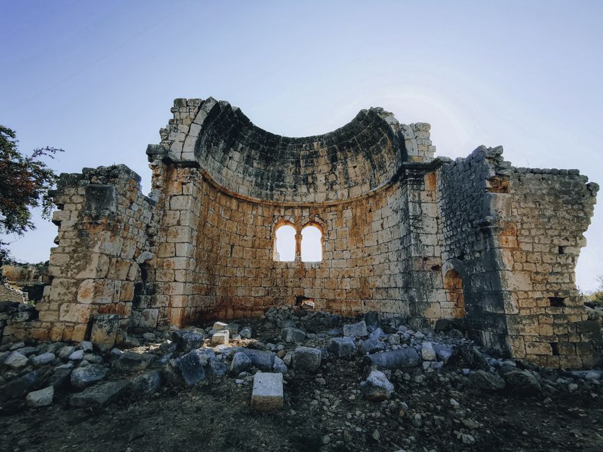 Explore the majestic remains of a historic stone church in ruins.