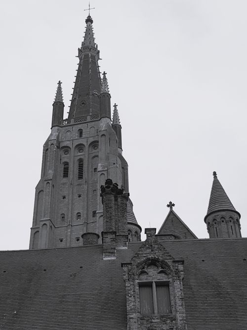 Free Black and white photo of the Church of Our Lady's gothic tower in Brugge. Stock Photo