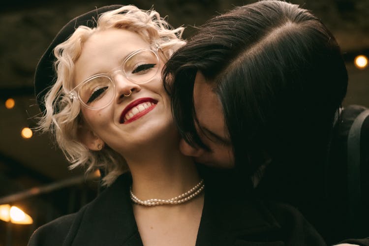 Man Kissing His Girlfriend On The Neck