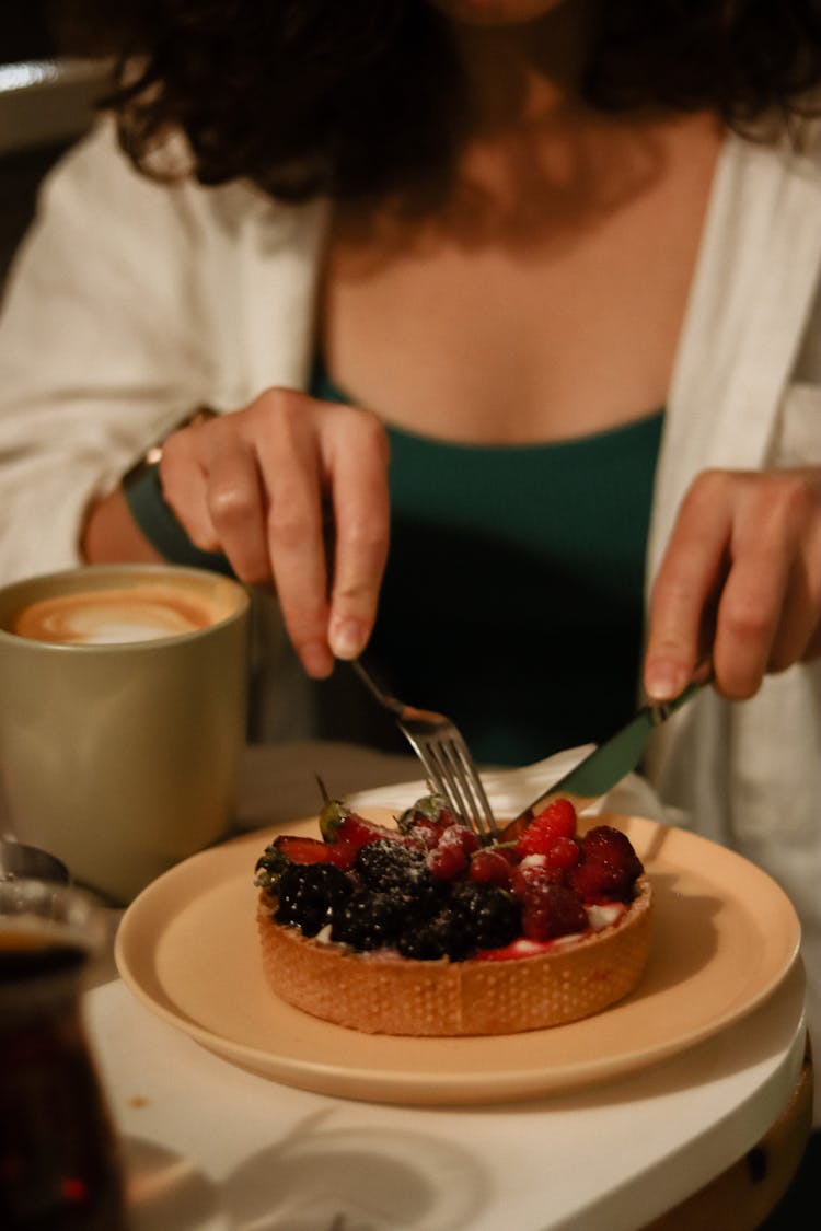 Woman Eating Dessert With Fruits