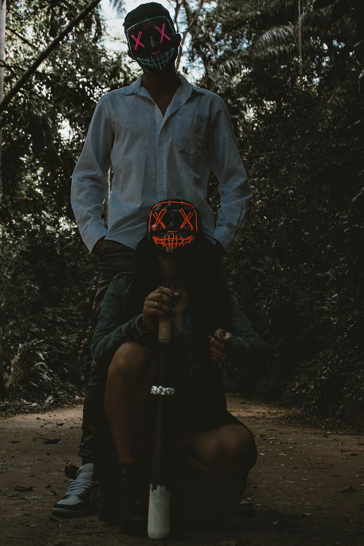 Couple Wearing Creepy Masks