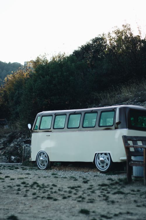 Free Classic vintage camper van parked outdoors in serene landscape. Stock Photo