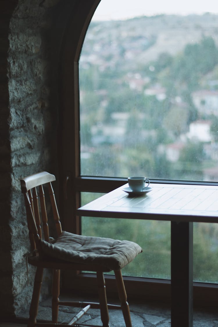 Cup On Plate On Table Near Window