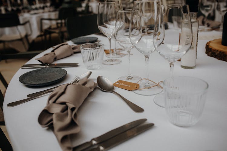 Silverwarer And Glasses On Table