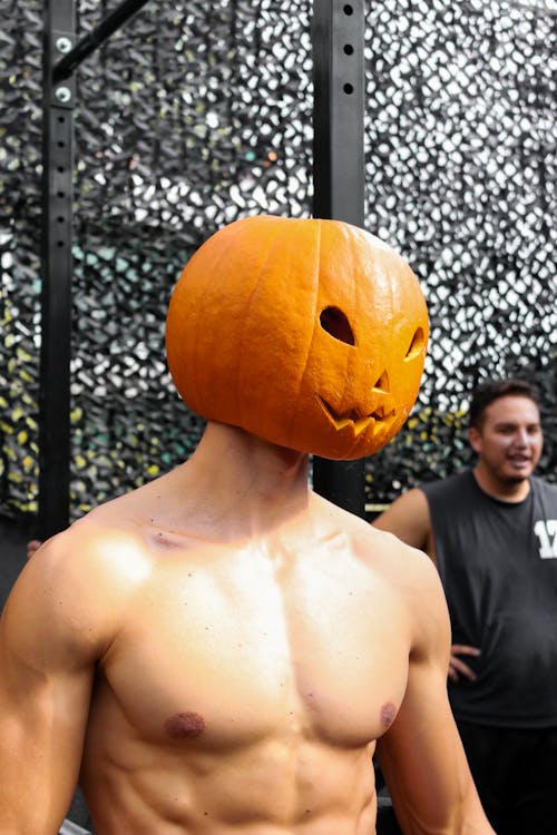 Topless Man in Pumpkin Head