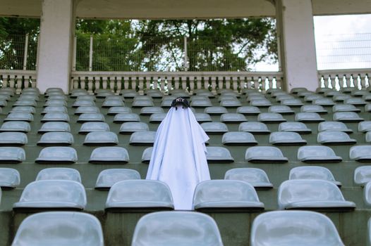 Photo of a Ghost Costume Among Empty Seats