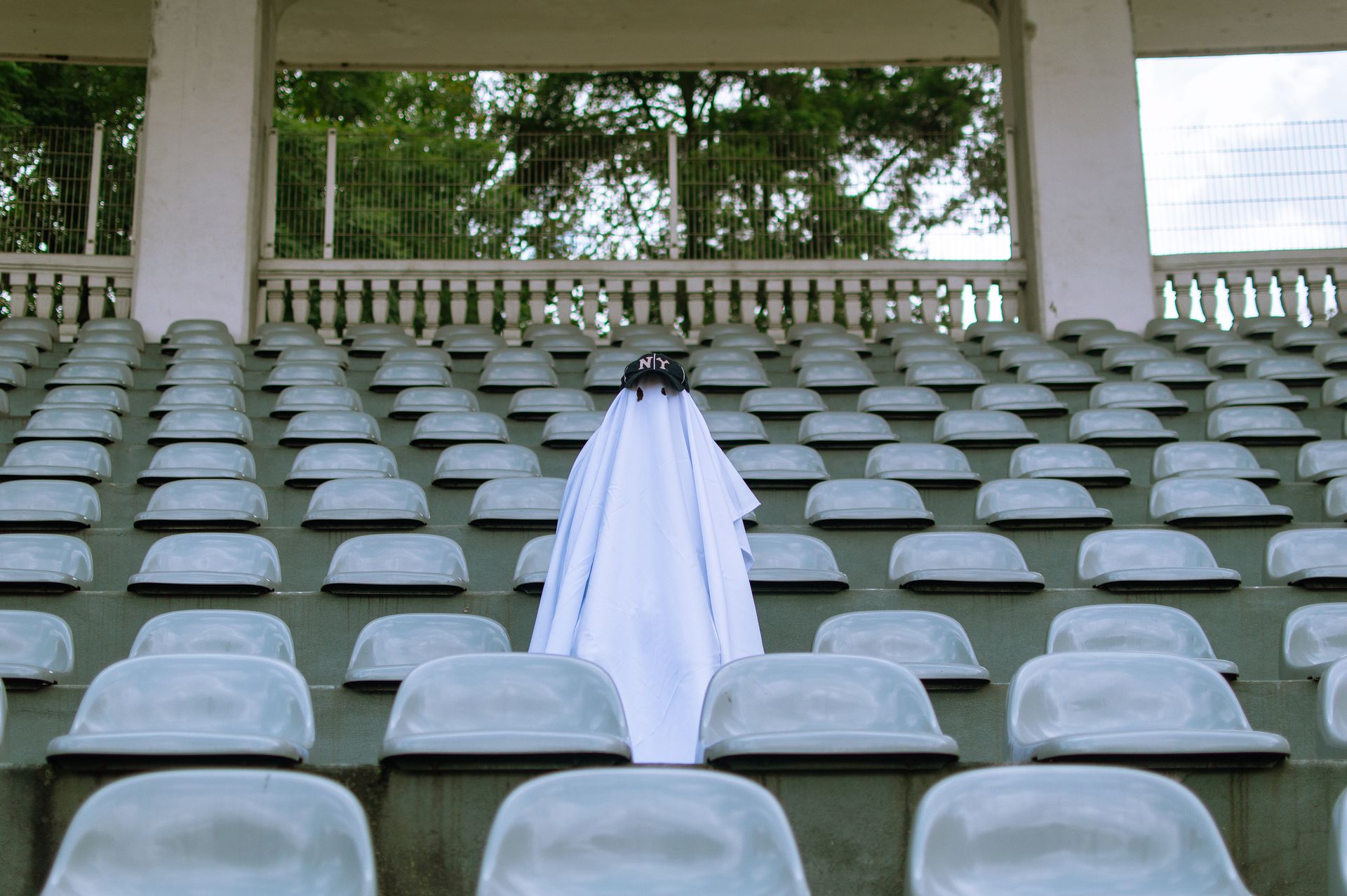 Photo of a Ghost Costume Among Empty Seats