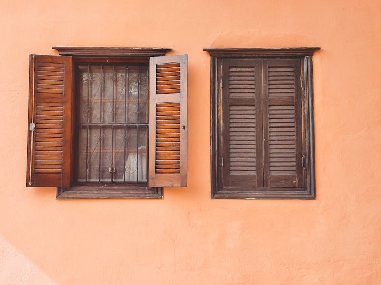 Brown Wooden Windows On Concrete Wall