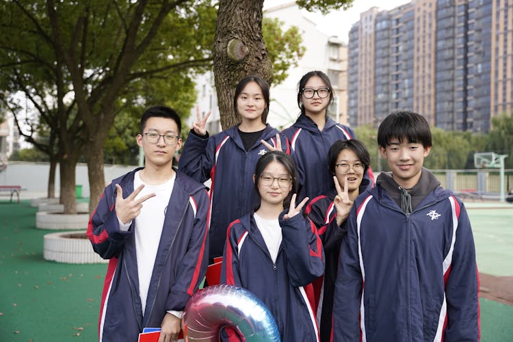 Group Of Students Standing Under A Tree