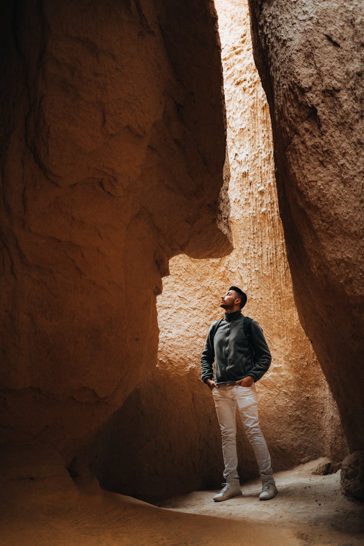 Man Standing In A Canyon Cave