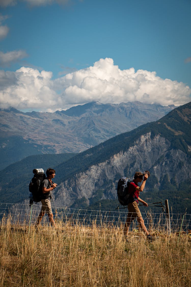 Men Hiking On Mountain