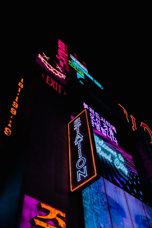 Low Angle Shot of Neon Signages