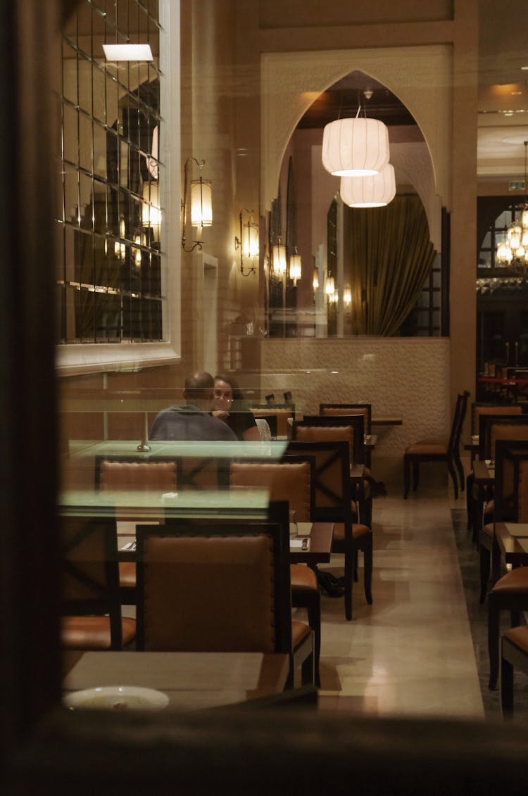 Man And Woman At Meeting In Restaurant