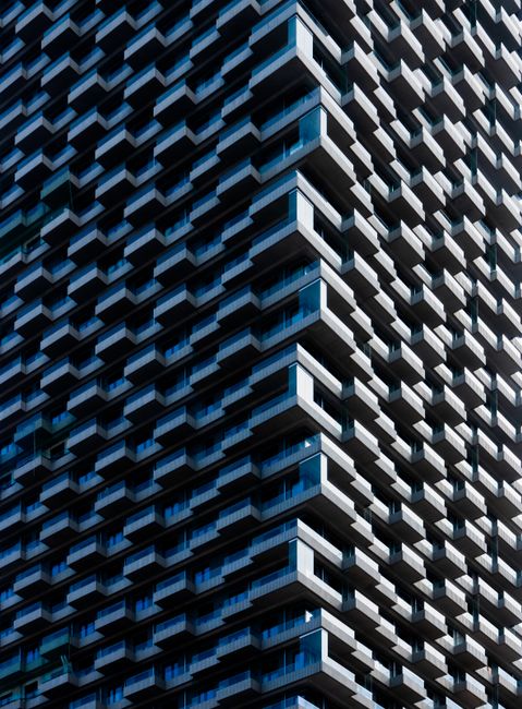 Architectural detail of a modern high-rise facade in Vienna, showcasing unique geometric patterns.
