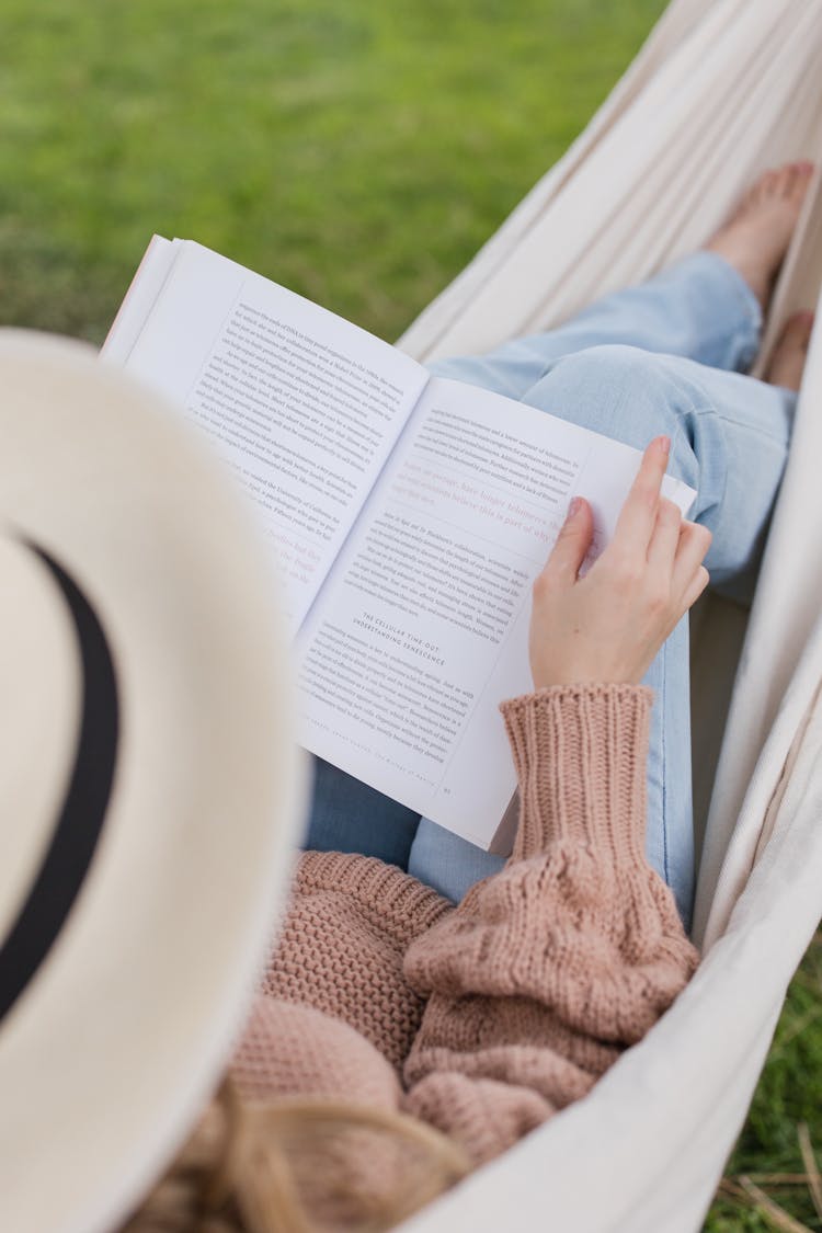 Woman On A Hammock Reading A Book