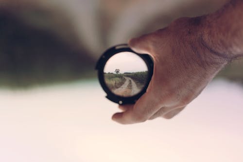 Person Holding Lens Focus Photography