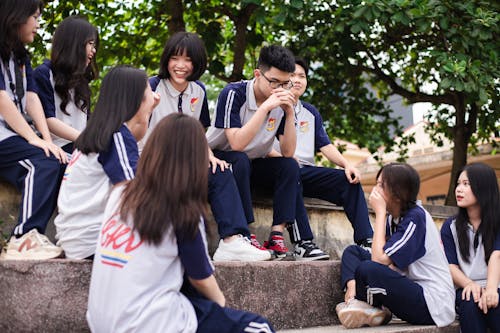 People Sitting on Concrete Stairs