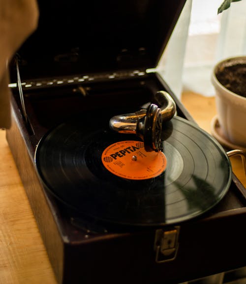 Free Black Vinyl Record Player Beside White Ceramic Mug Stock Photo