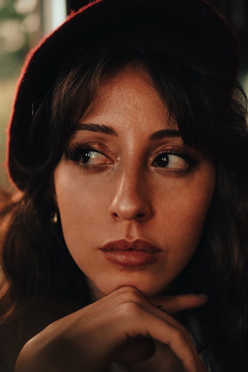 Portrait of a Brunette Woman Wearing a Hat