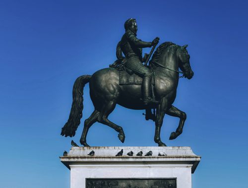 Free A striking view of the Henri IV equestrian statue located at Pont Neuf in Paris, France. Stock Photo