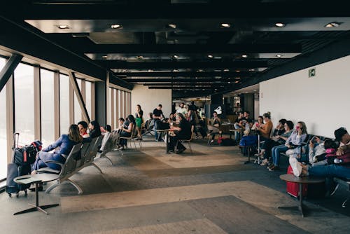 People Sitting Inside the Airport Terminal