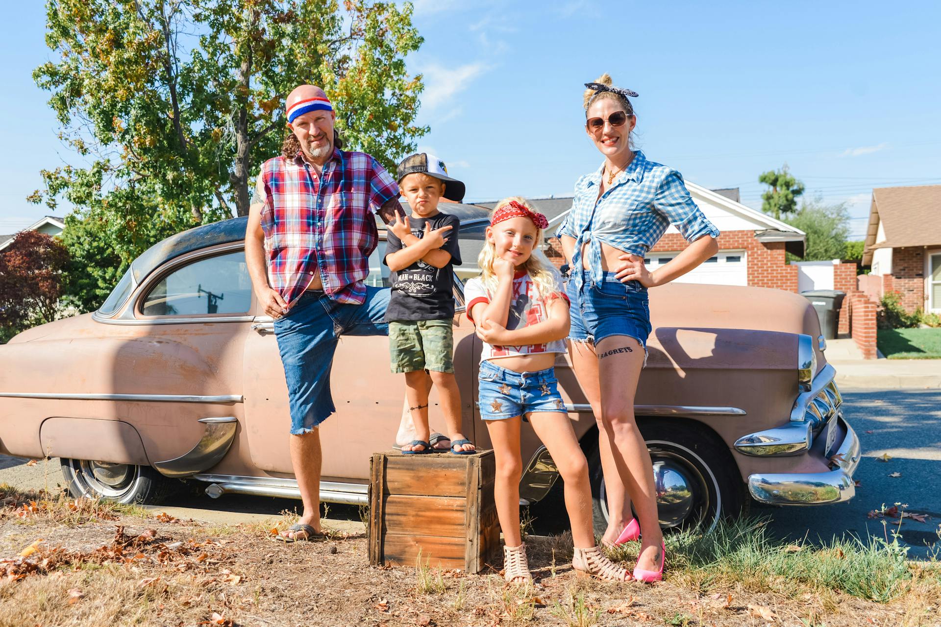 Group of People Standing Beside Car