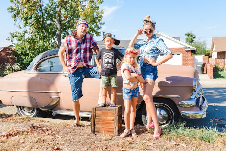 Family Posing In Front Of Retro Car