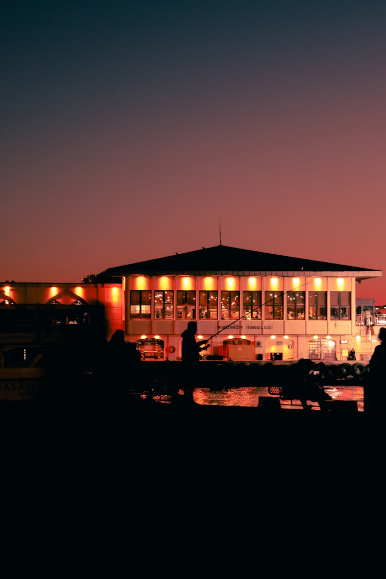 Building Near Water At Sunset