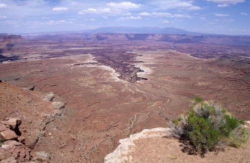 Free Expansive view of the arid terrain in Moab, Utah under a clear sky. Stock Photo