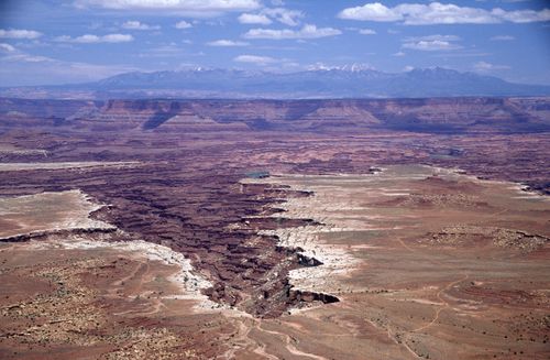 Free Breathtaking aerial photo showcasing the vast Canyonlands in Moab, Utah under clear blue skies. Stock Photo