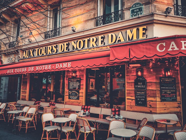 Aux Tours De Notre Dame Restaurant Signage On Exterior Wall Of A Building